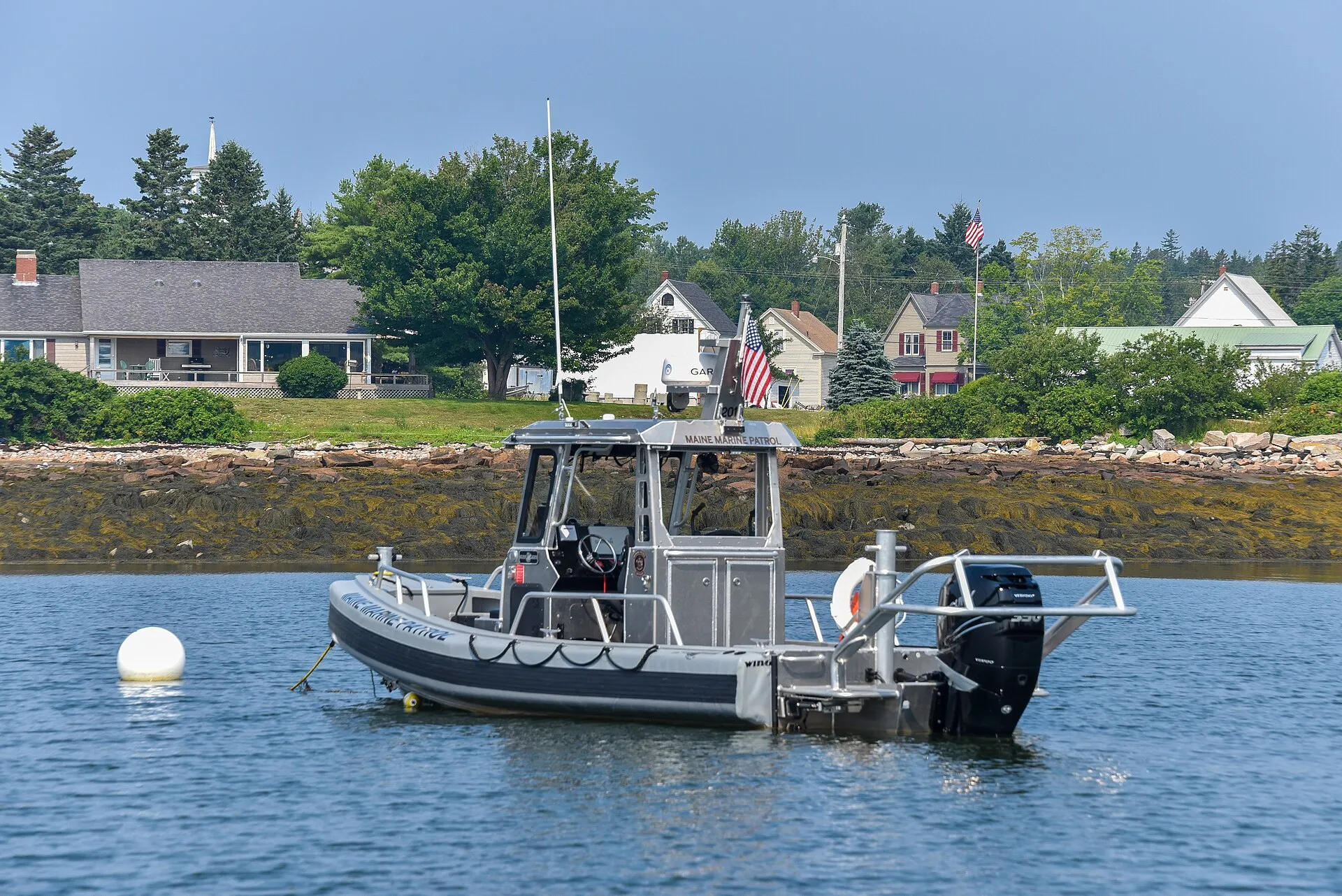 Maine Marine Patrol boat in the harbor at Winter Harbor, Maine.