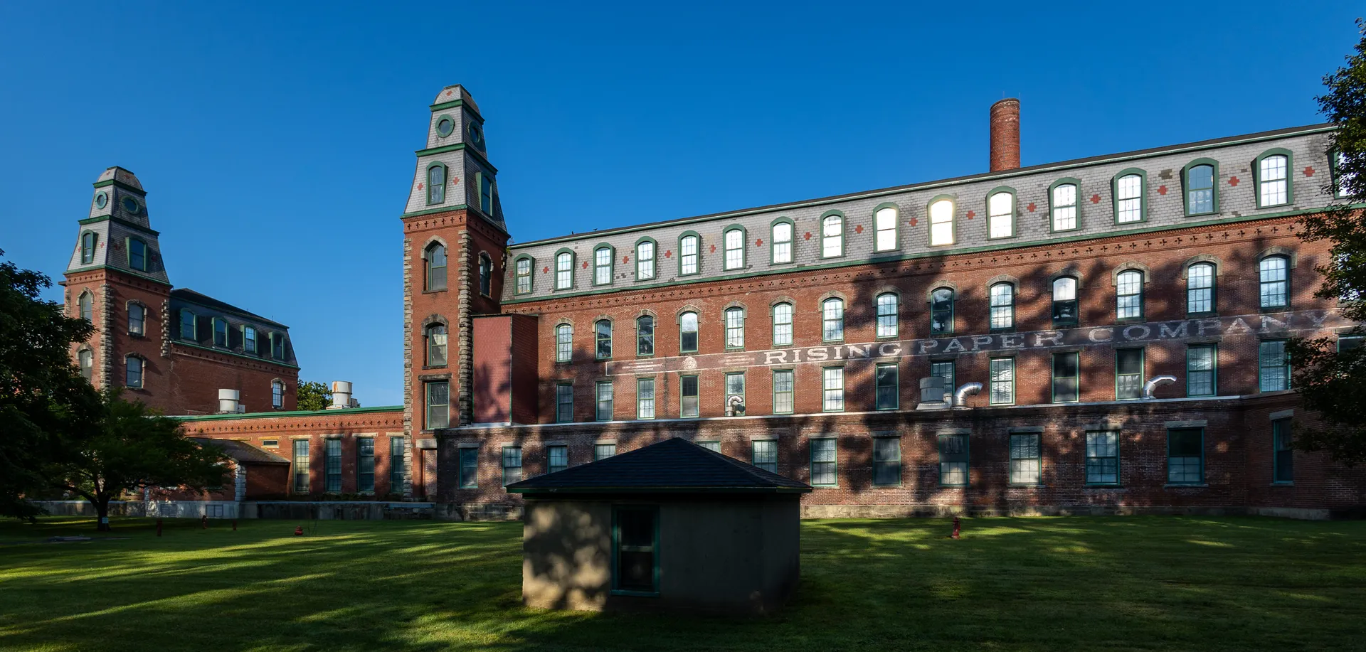 Historic Rising Paper Company mill complex with towers in Housatonic, Massachusetts.