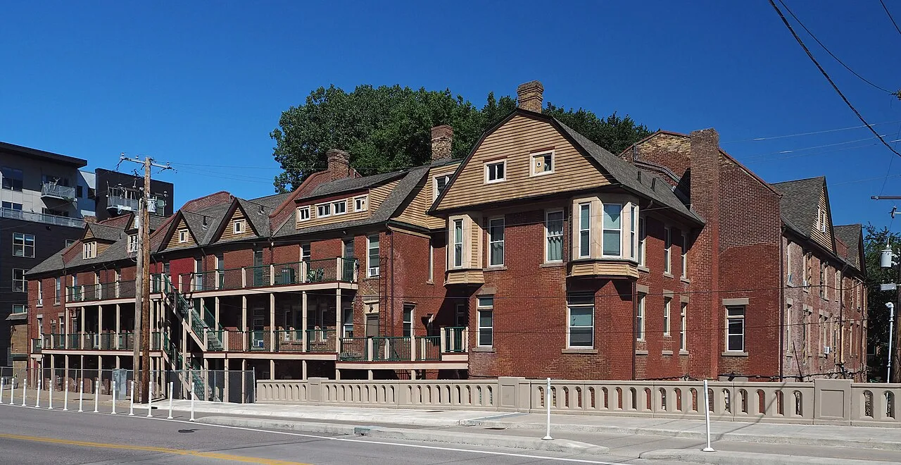 Florence Court’s brick residential buildings beside University Avenue Southeast in Marcy-Holmes, photographed June 30, 2024.