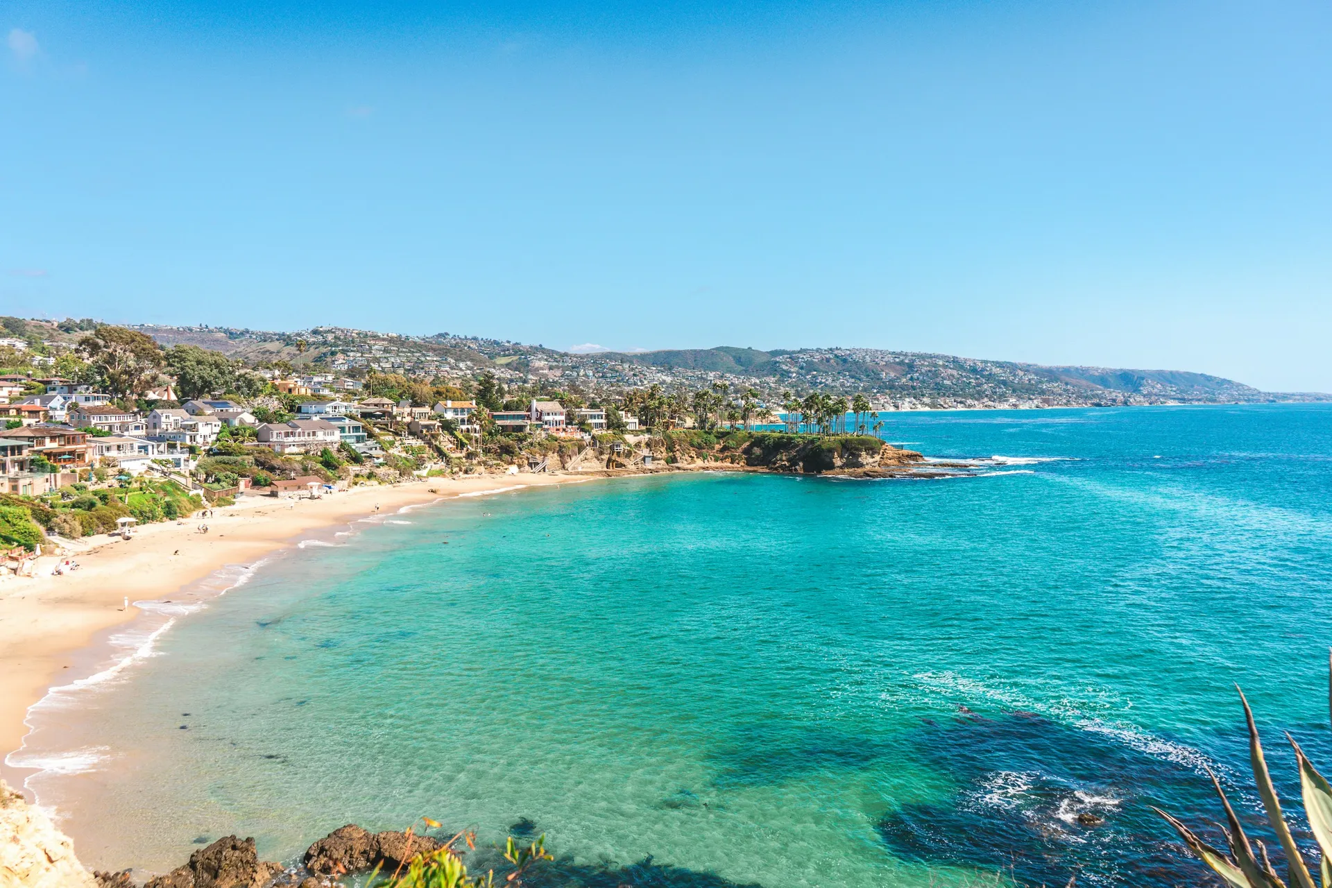 a view of a beach with clear blue water, Laguna Beach, CA.
