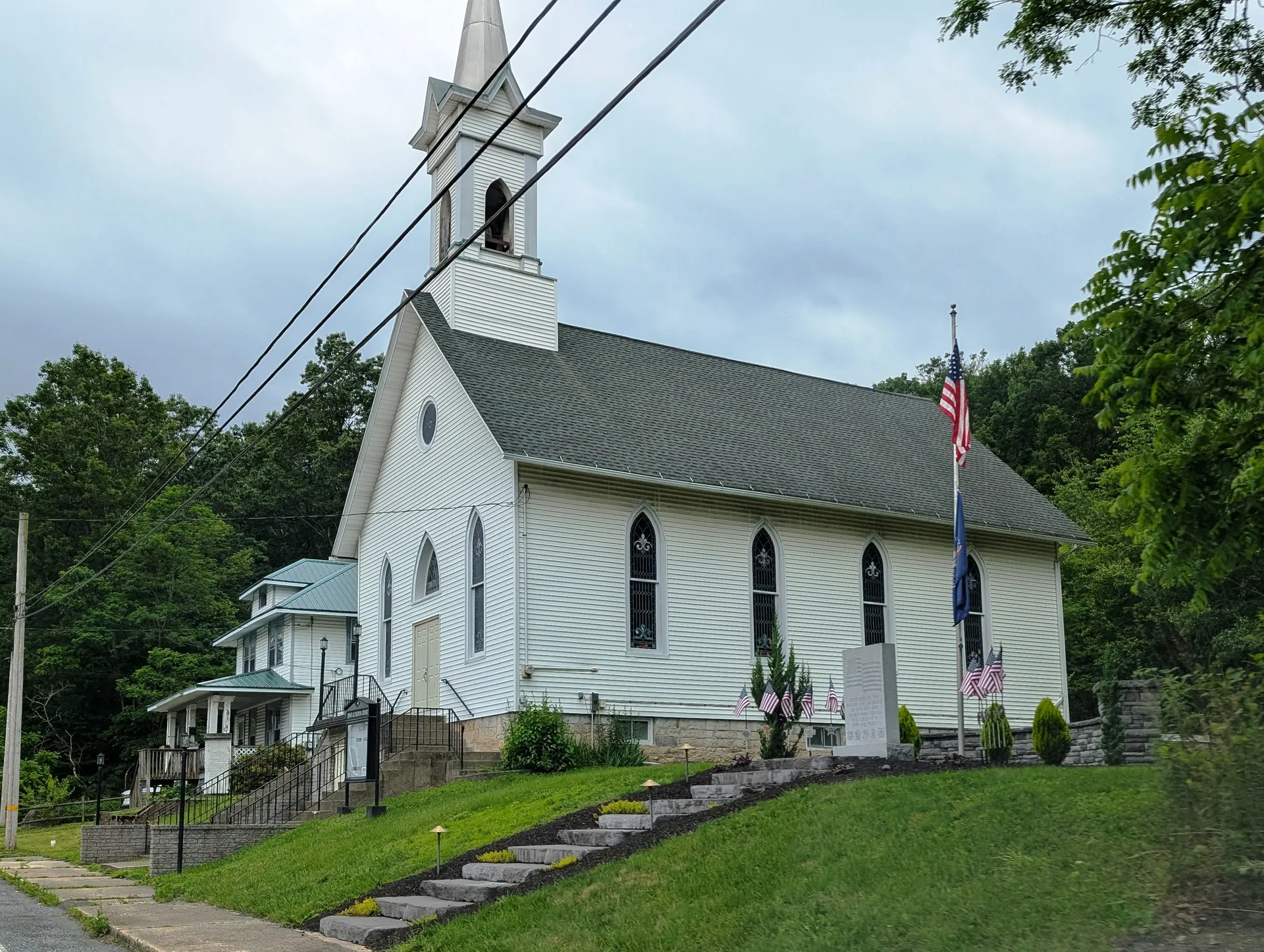 Zion Lutheran Church in Donaldson is a white frame church with a tall steeple, next to a veterans memorial on West Center Street.