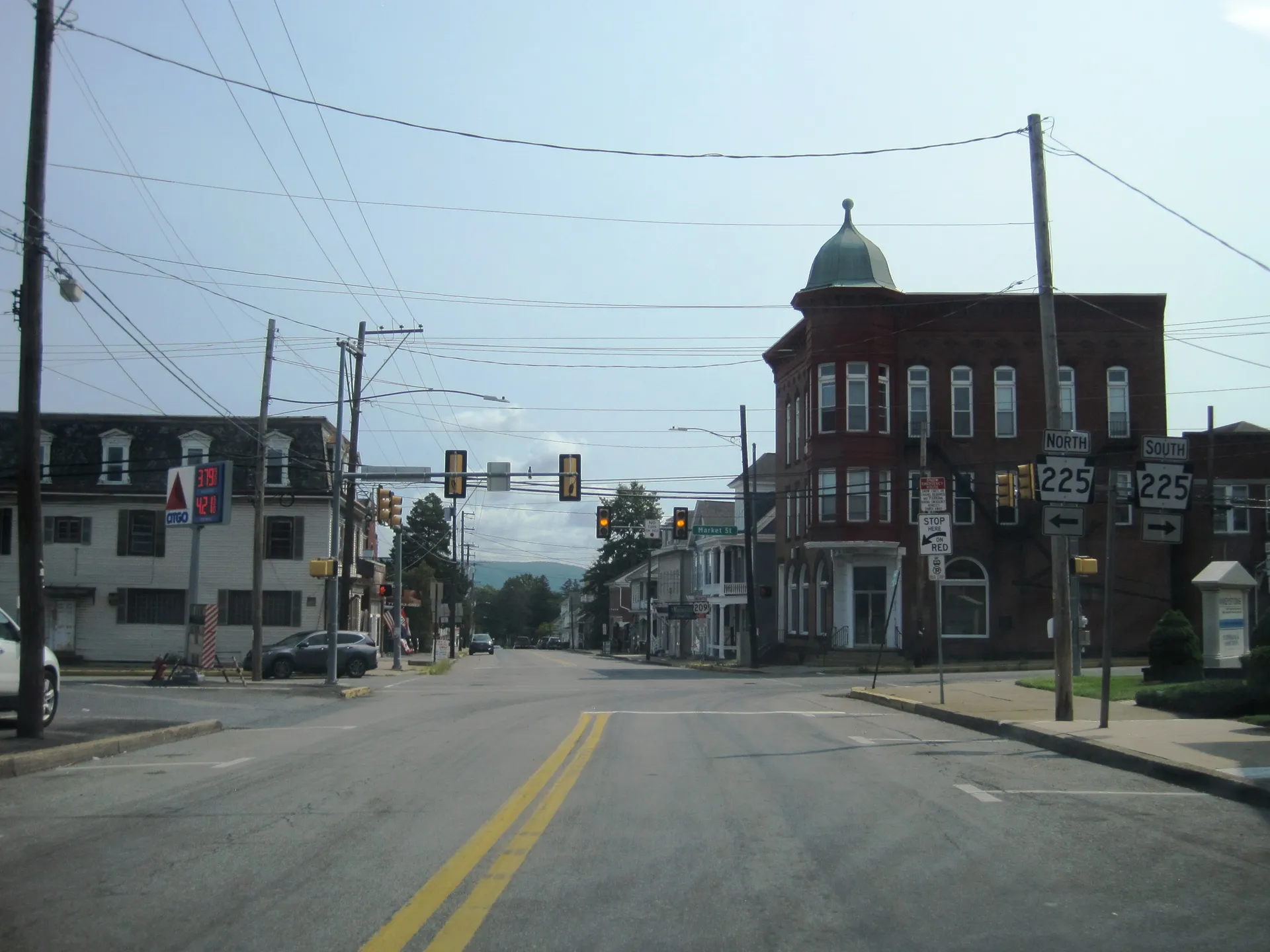 Main Street (U.S. Route 209) meets Market Street in Elizabethville, where a domed corner tower tops a brick commercial building.