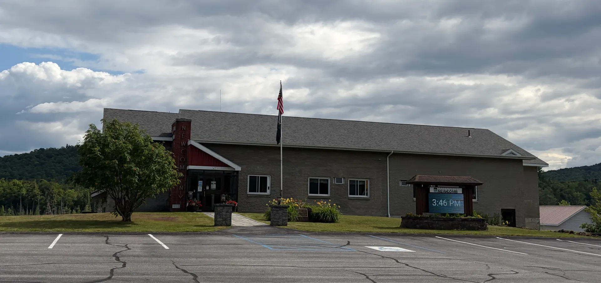 Newcomb Town Hall with a flag in Newcomb, New York.