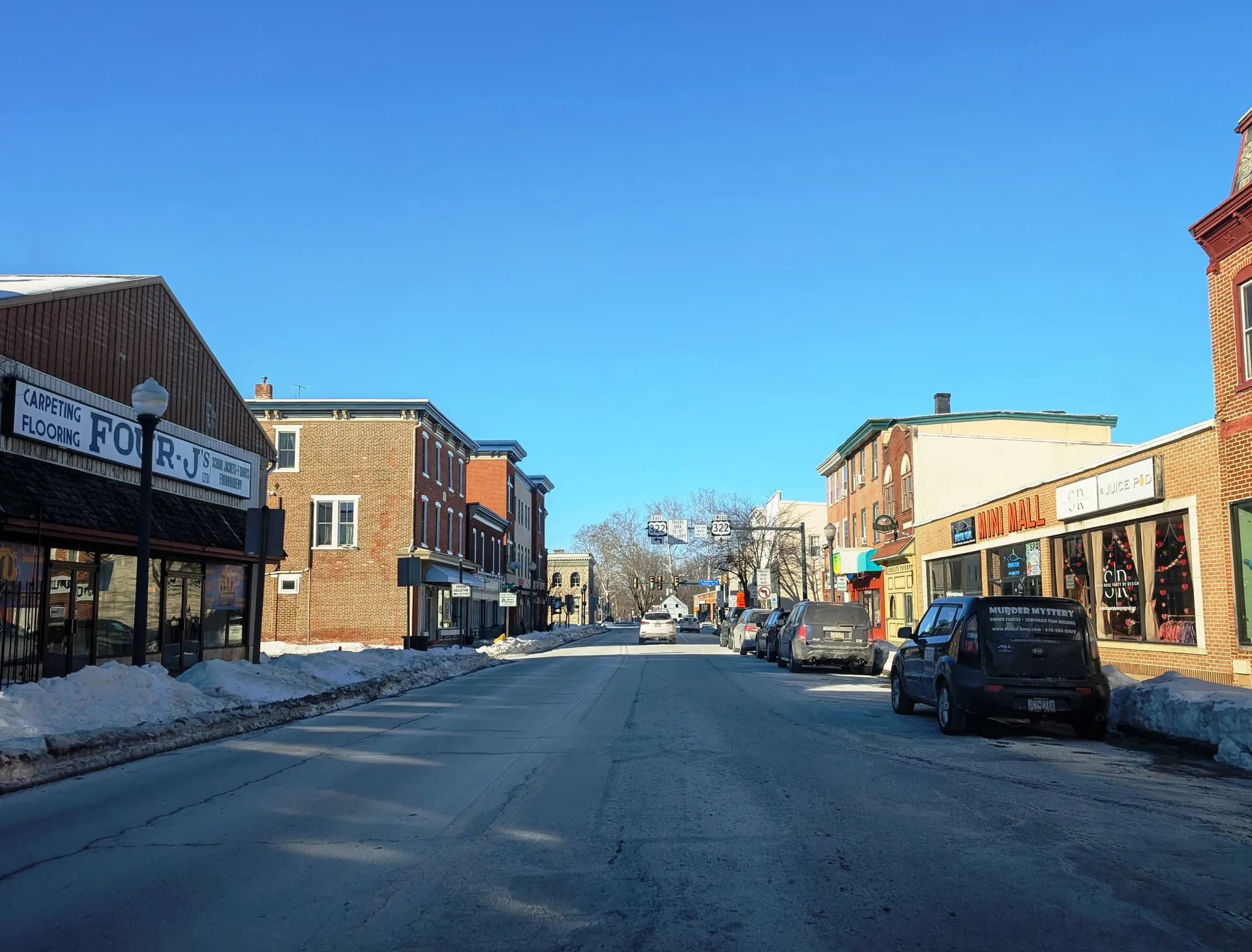 East Lancaster Avenue in Downingtown passes brick storefronts and parked cars as it approaches its junction with U.S. 322.