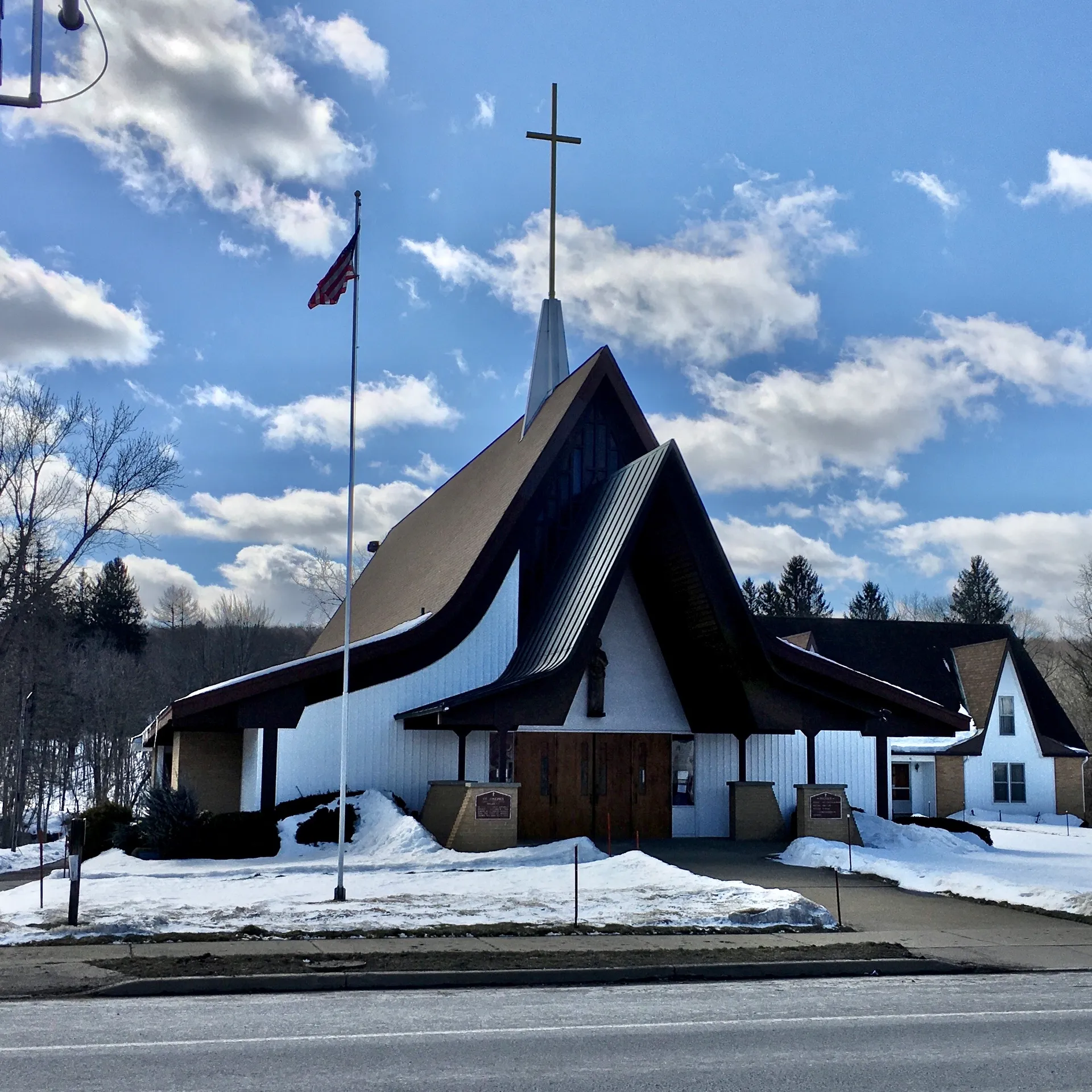 St. Joseph Catholic Church with a white steeple in Holland, New York.