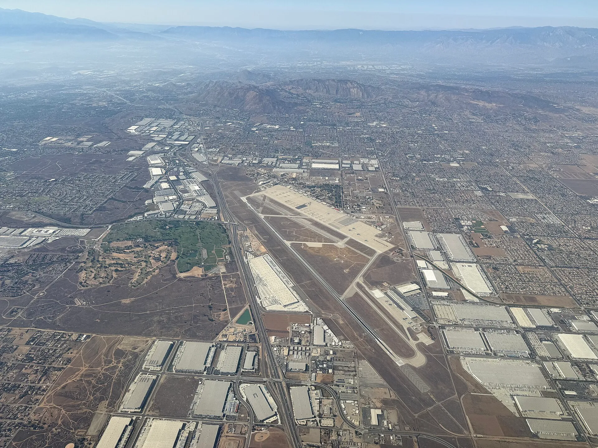 Aerial view of March Air Reserve Base and surrounding development near Mead Valley, California.