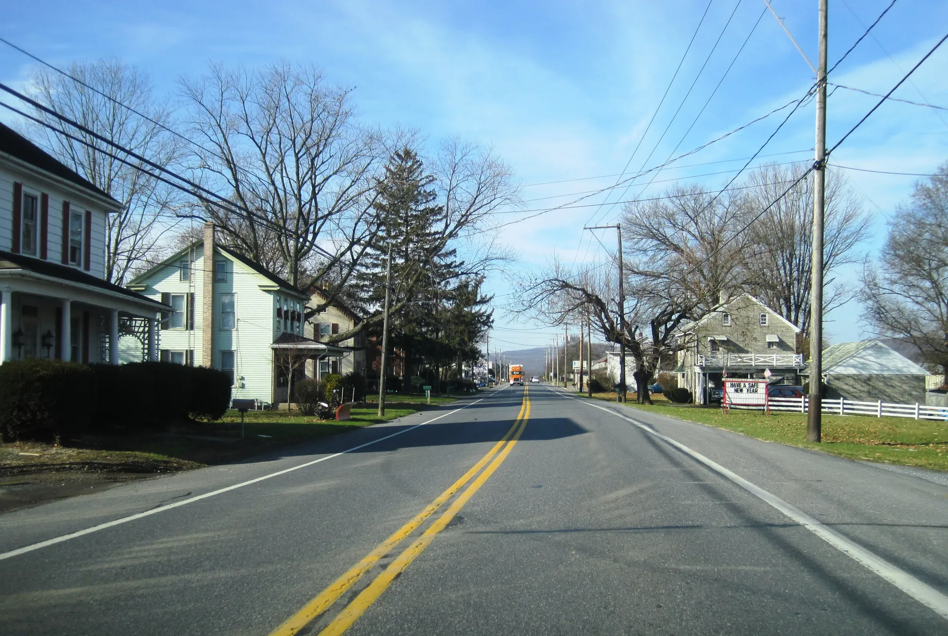 U.S. Route 322 passes through the Lancaster County village of Brickerville between Hopeland and Keener roads, lined with homes and leafy trees.
