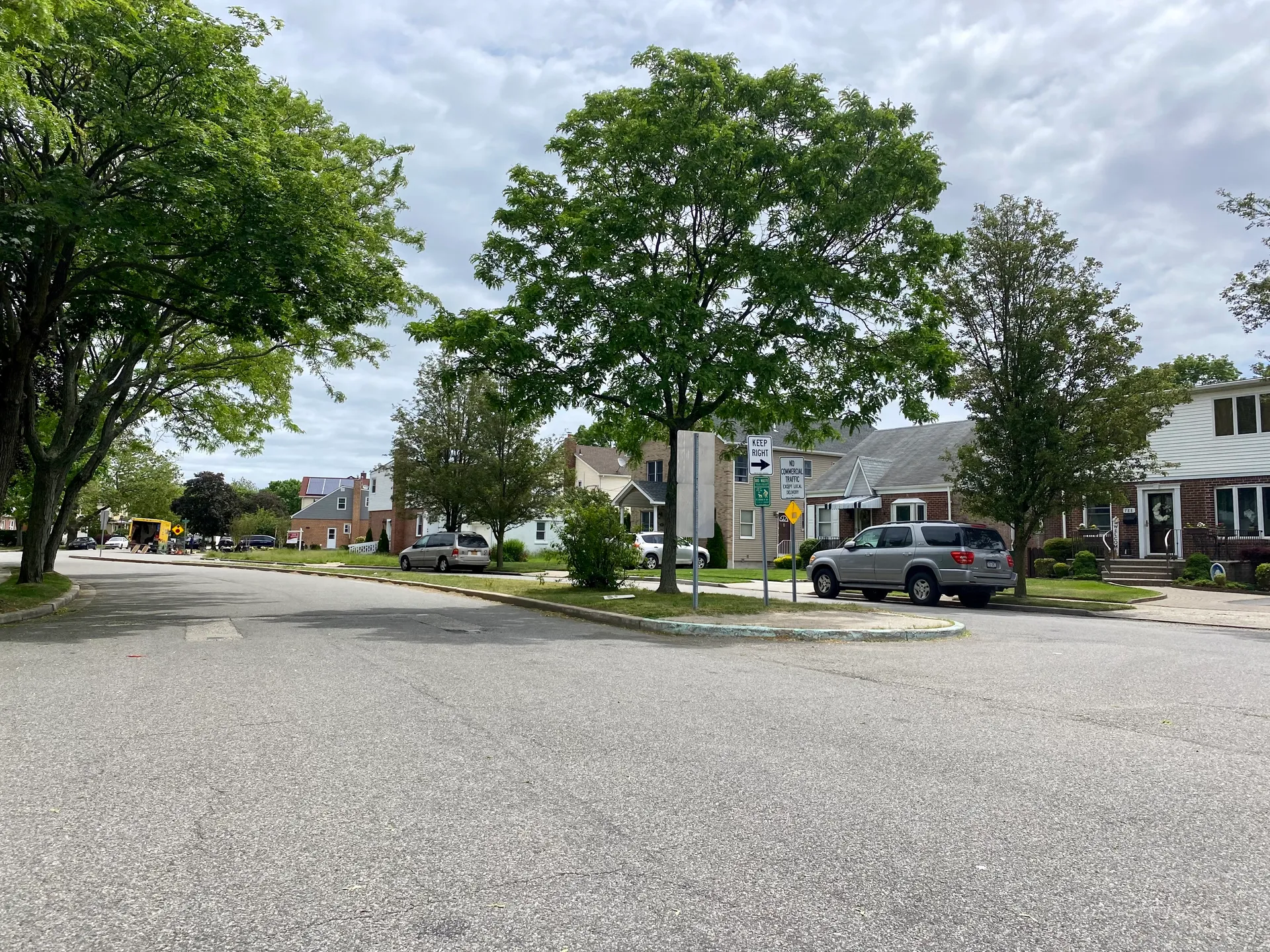 Residential street with shade trees in North New Hyde Park, New York.