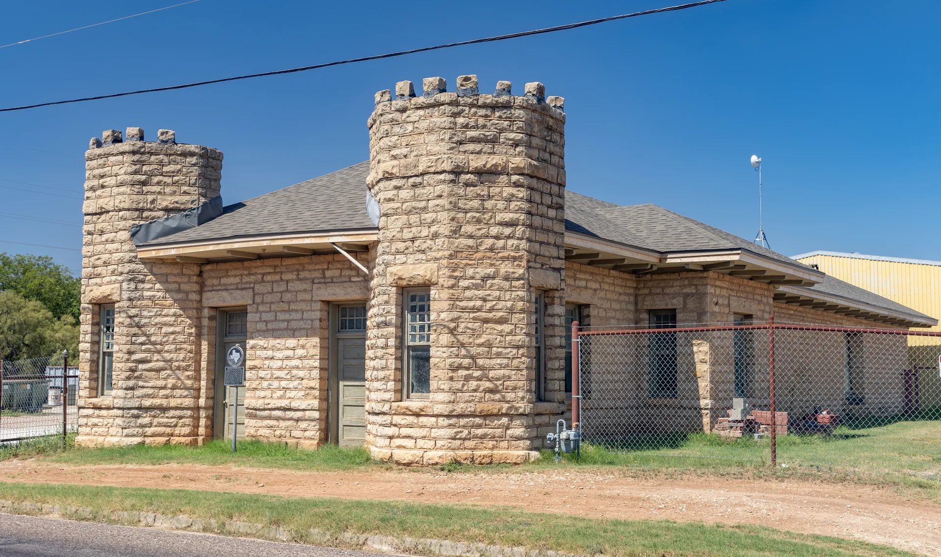 Abilene and Southern Railway Depot with stone towers in Ballinger, Texas.