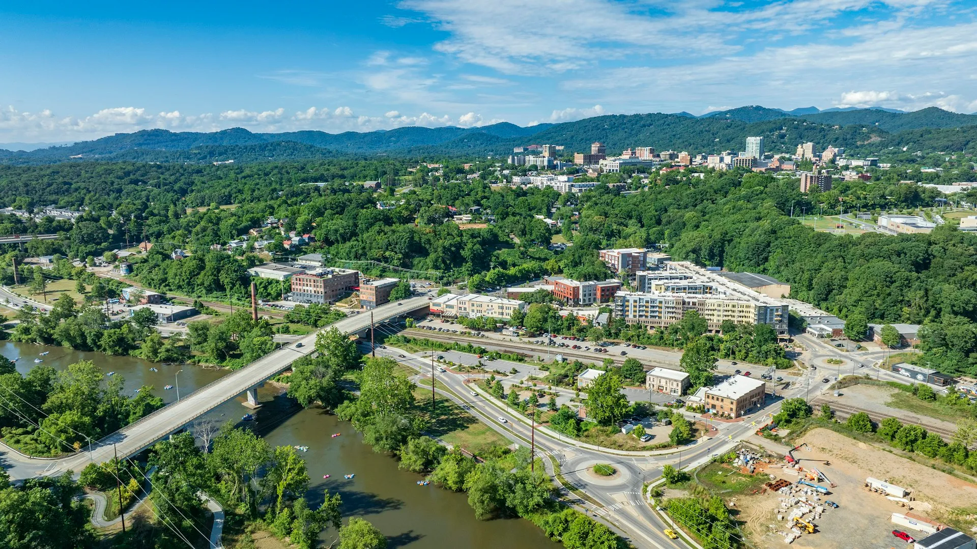 Asheville, NC — Asheville skyline, river and surrounding mountains from above.