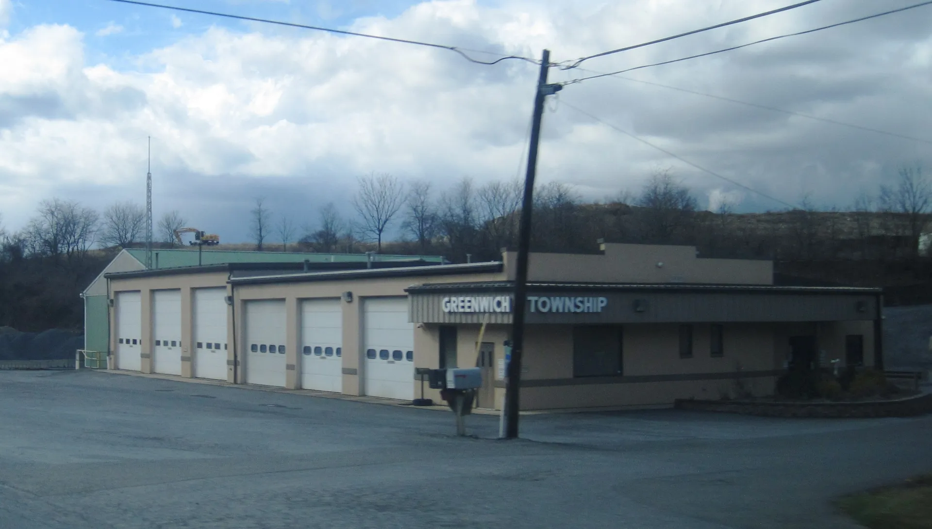 Greenwich Township's municipal building is a tan building with several garage bays along Old Route 22.