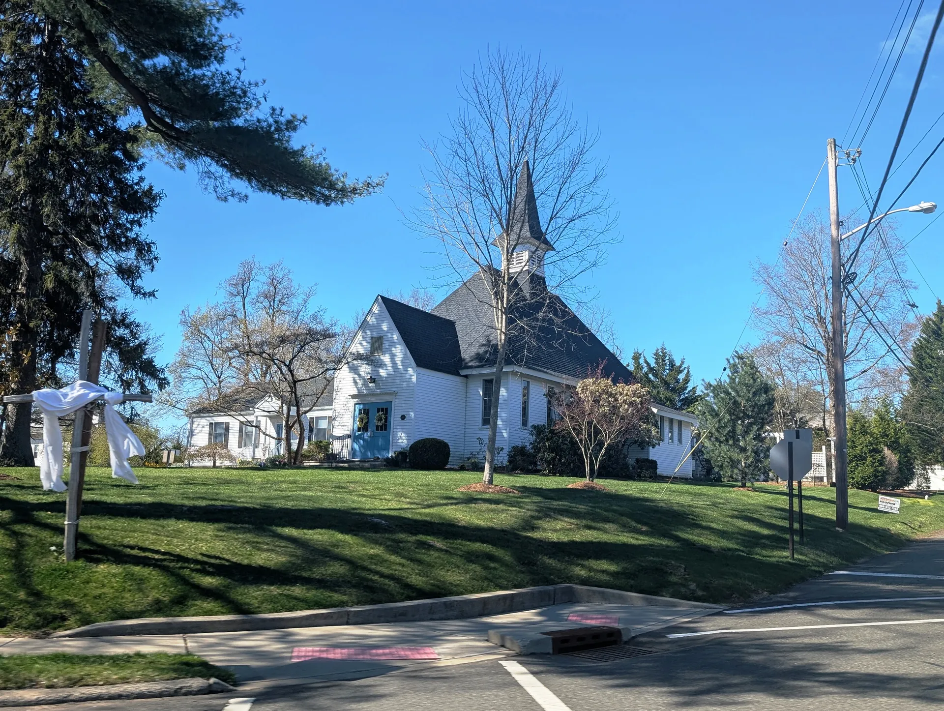 First Presbyterian Church in Stirling, Long Hill Township, is a white church with a tall spire behind a lawn.