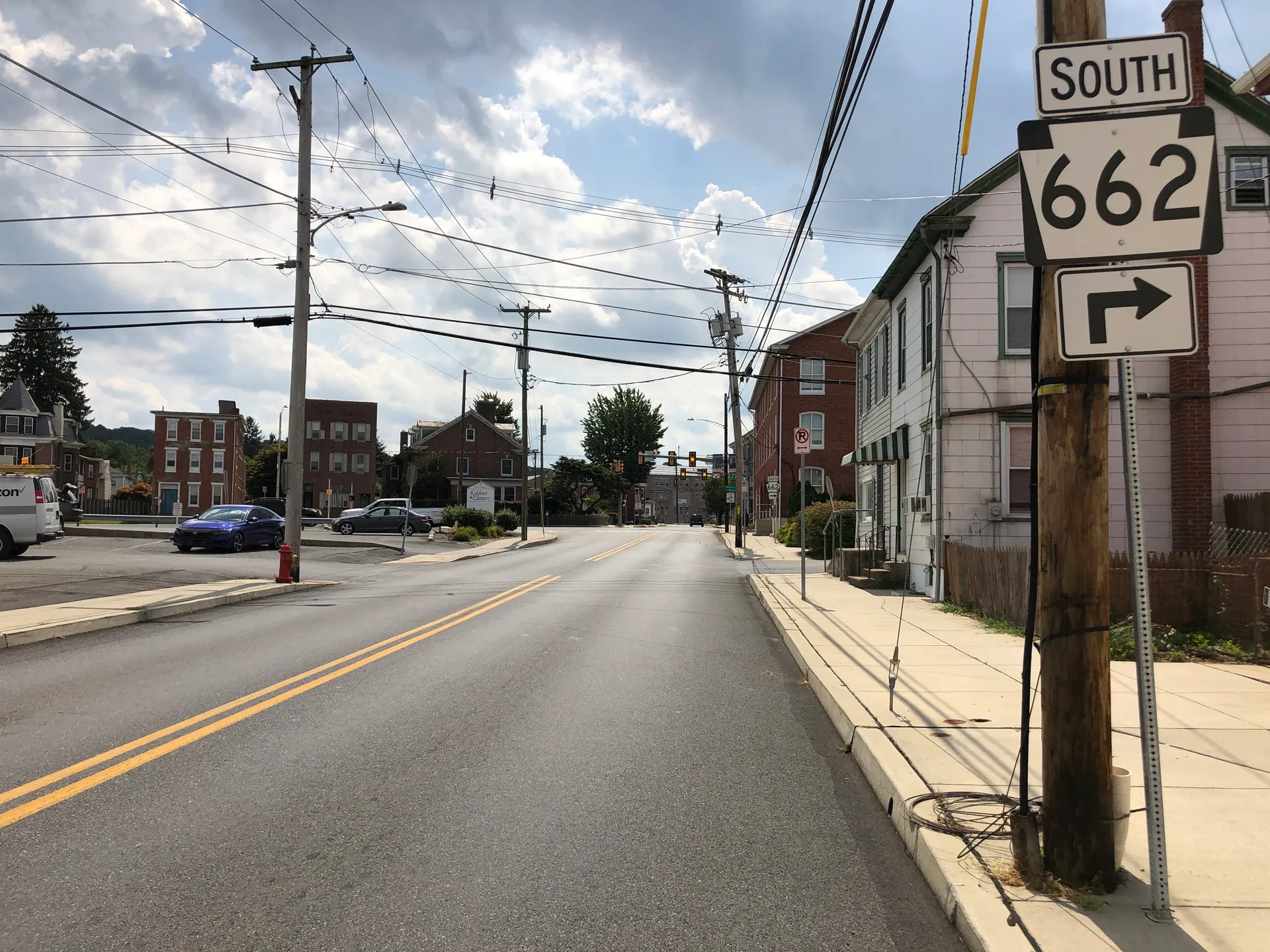 North Franklin Street (Route 662) in Fleetwood heads south between Washington Street and Myrtle Alley past brick homes and shops.
