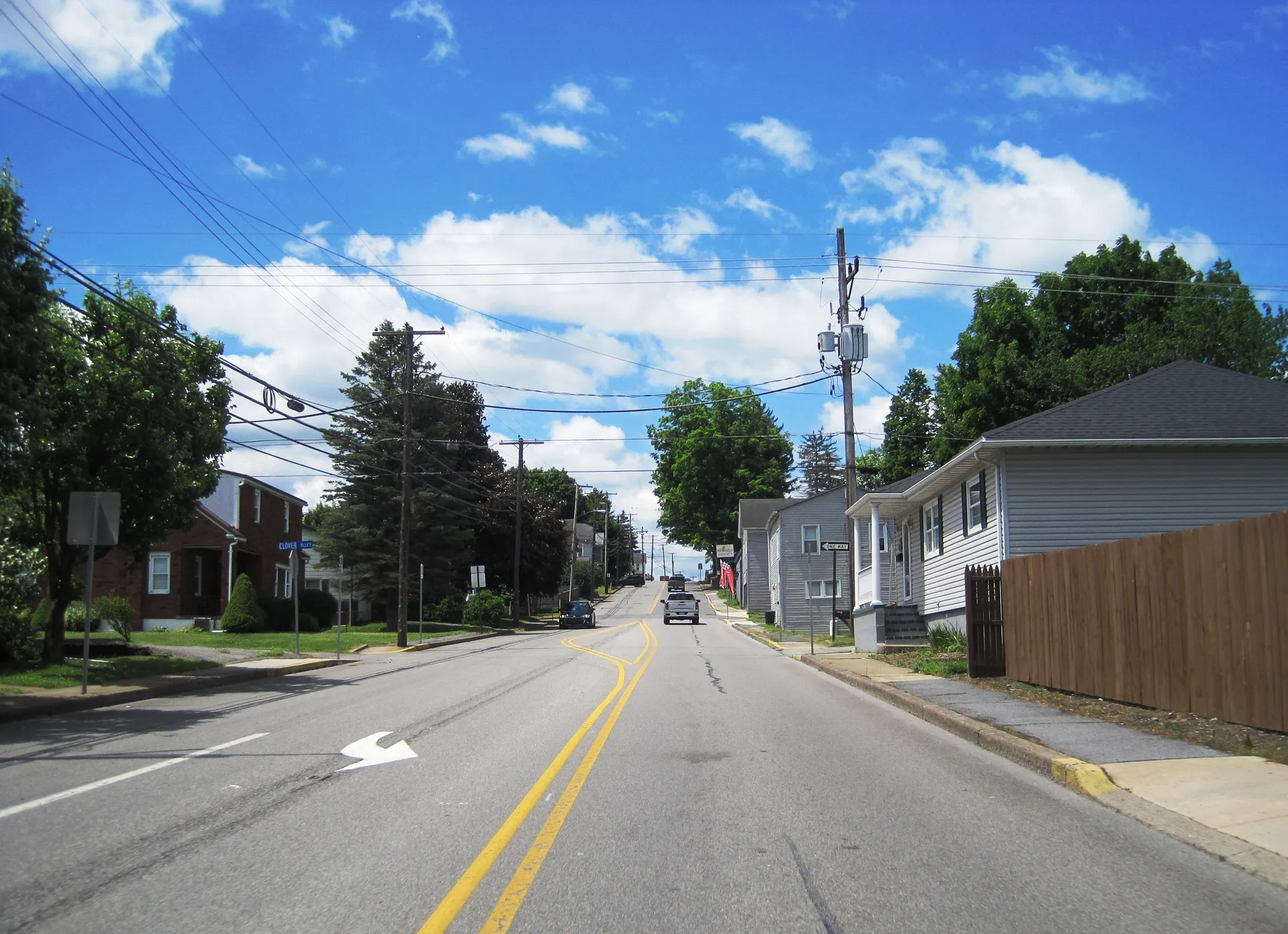 Route 53 runs southwest through Chester Hill between Gertrude and Clover streets, lined with houses and utility poles.