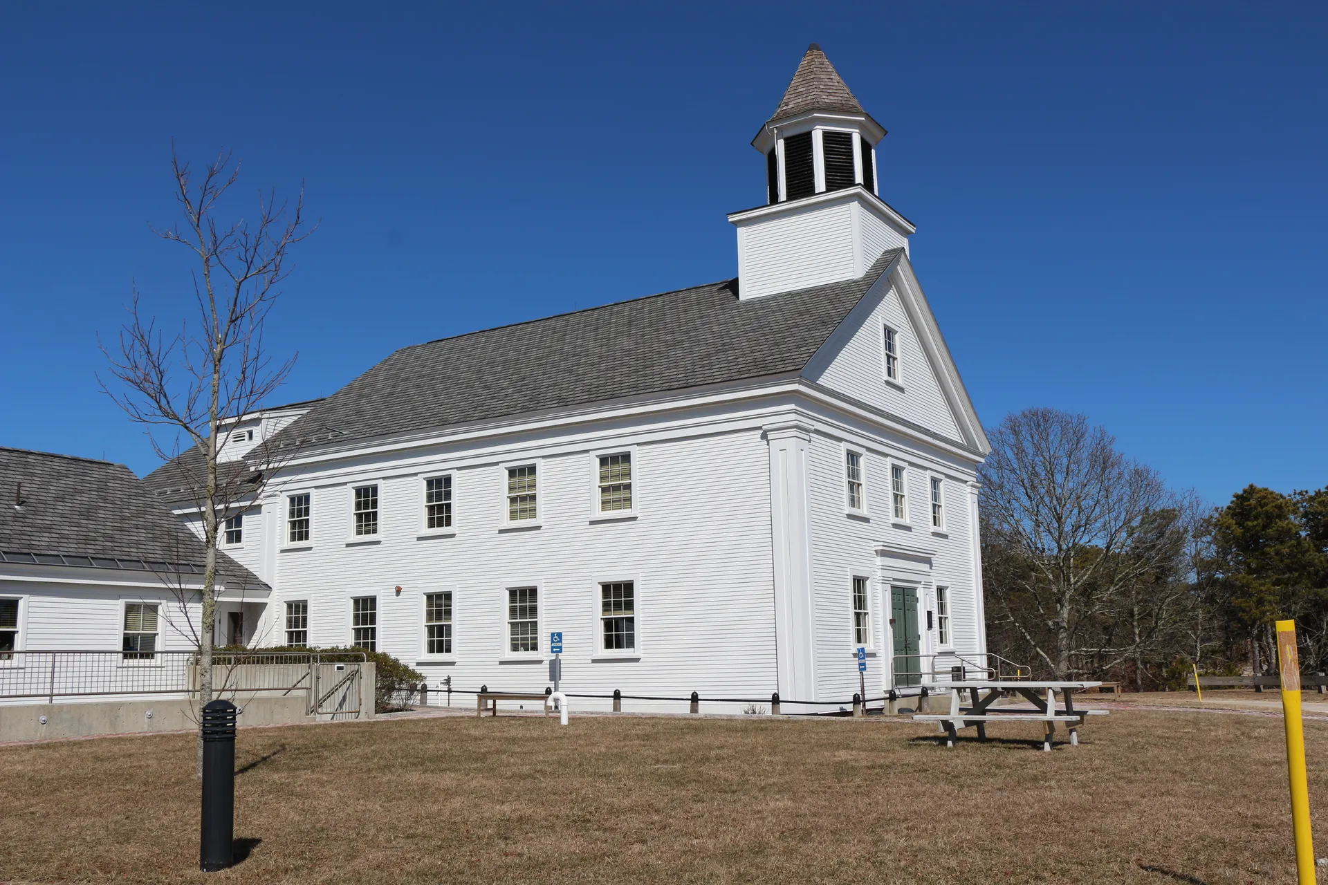 White historic Truro Town Hall on a hill in Truro, Massachusetts.