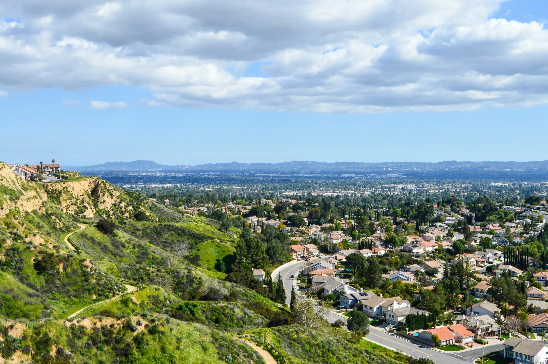 Aerial view across Porter Ranch homes and streets toward the surrounding hills
