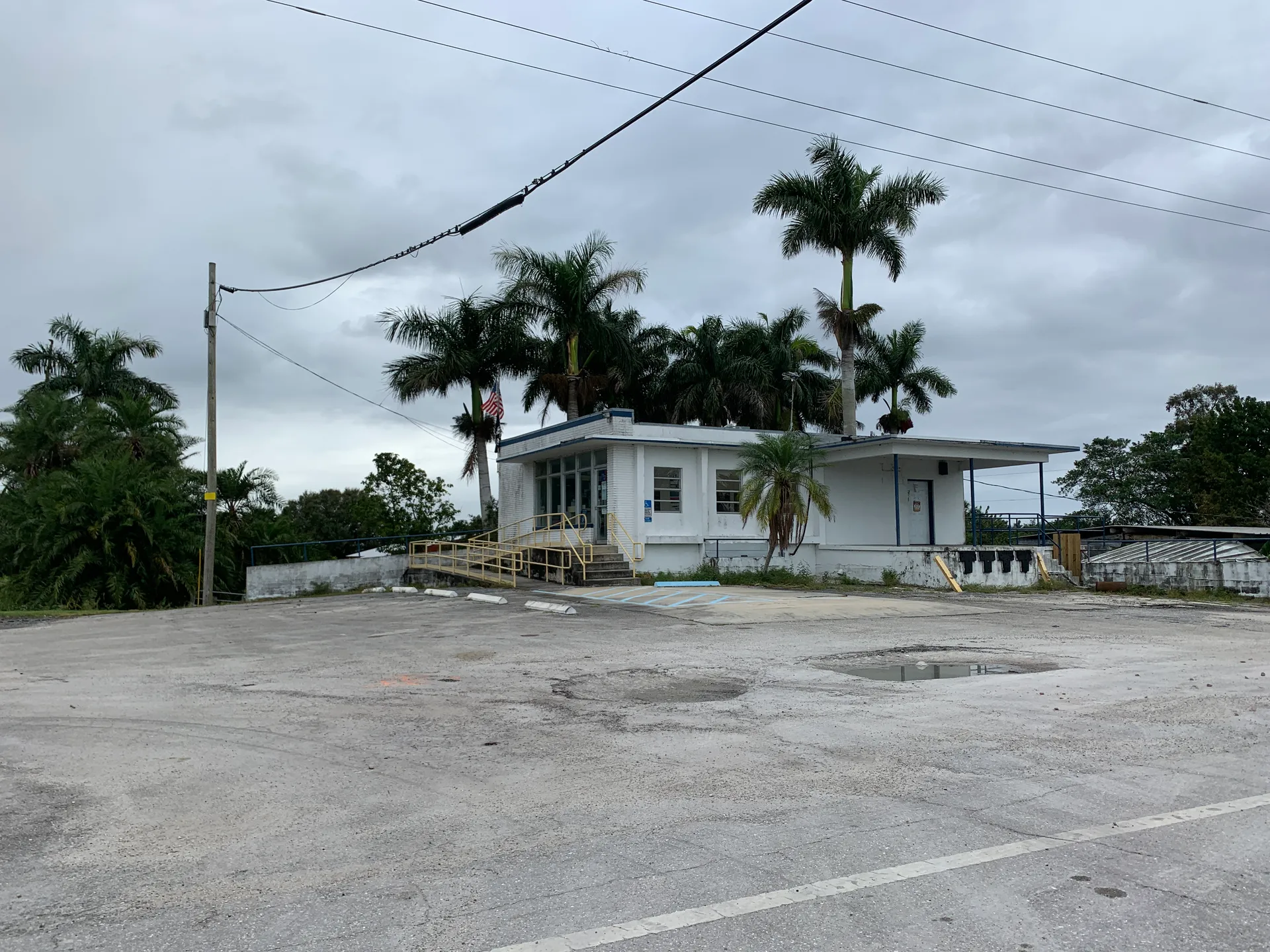 Post office building with palm trees in Lake Harbor, Florida.