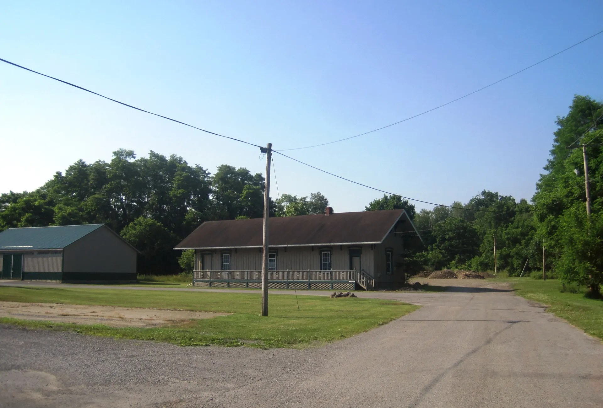 Jamestown's former New York Central Railroad station is a long low building with a broad roof facing Main Street.