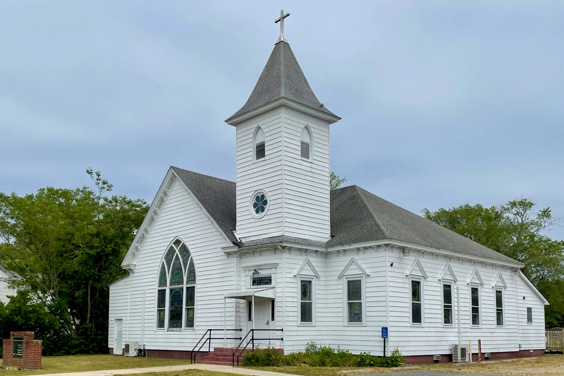 The United Methodist Church in Heislerville is a white clapboard church with a tall pointed steeple and arched windows.