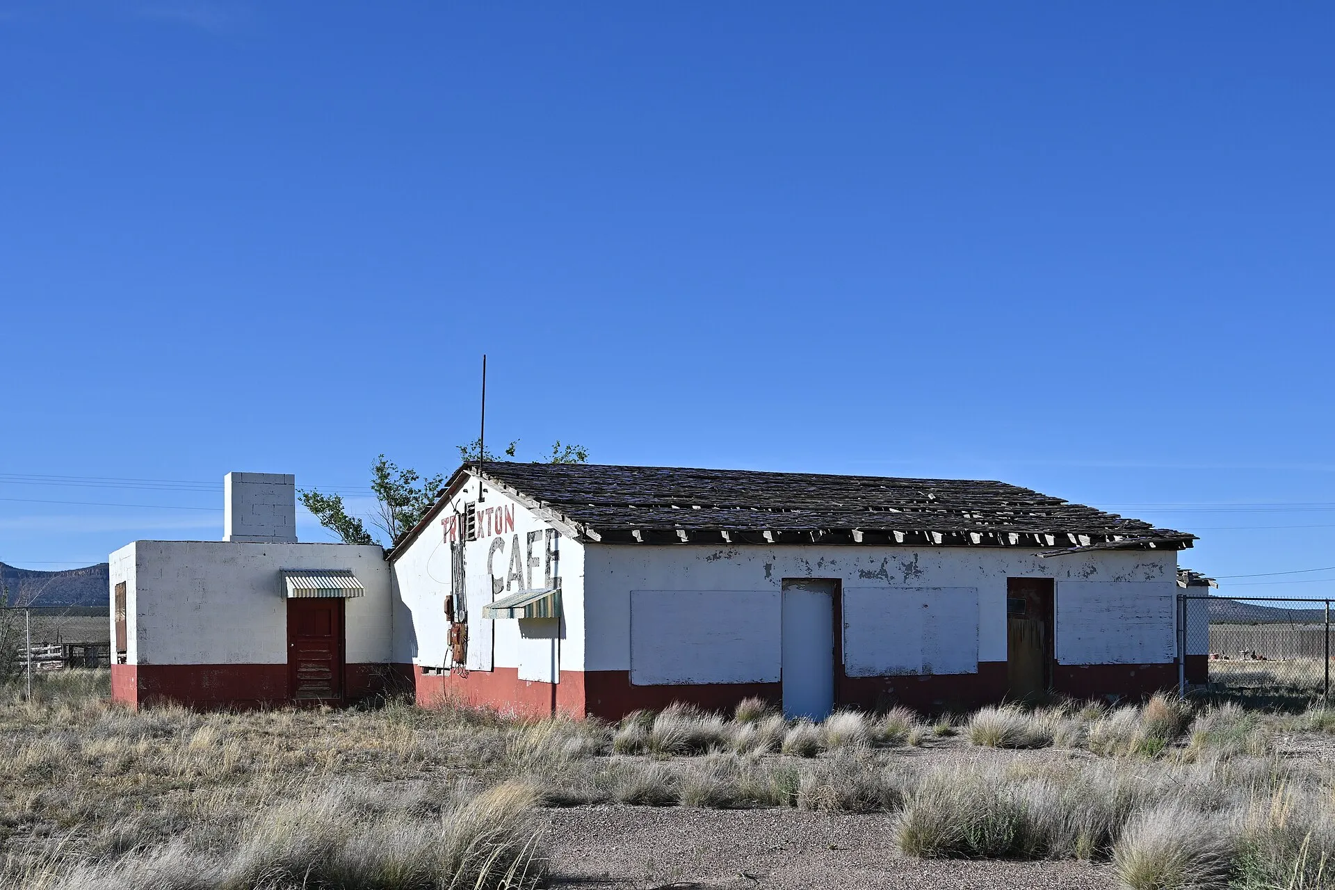 An abandoned and dilapidated Truxton Cafe, the roof is in very bad shape. At one time this was a Texaco gas station. 15961 Route 66, Truxton, Arizona 86437.